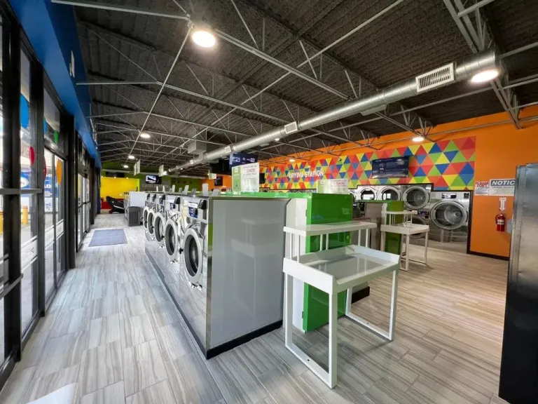 Interior of the Laundry R Us laundromat in San Antonio, Texas showing rows of Wascomat washers